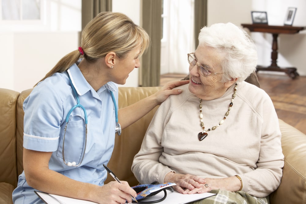 Senior receiving compassionate hospice care at home